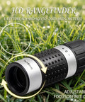 HD rangefinder from Ultimate Golf Gift Set for Men and Women with close-up on lens and focus details on grass background.