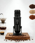 Robust Electric Burr Coffee Grinder With 48mm Conical Steel Burrs And 60 Dial Settings For Easy Single Dose Grinding displayed with coffee beans and brewed coffee.