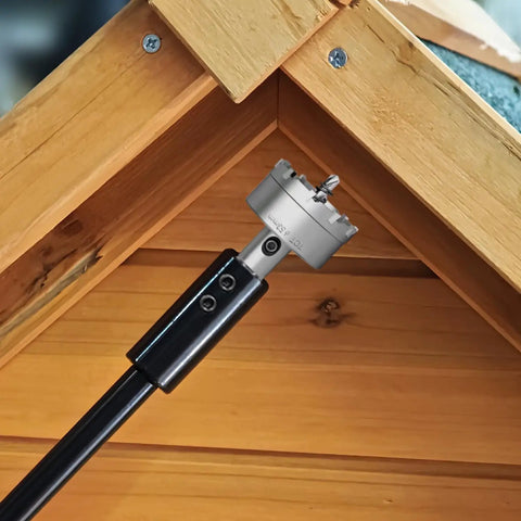 Seven Inch Forstner Bit Extension With 3/8 Drill Bit Extender attached to wood, showcasing deep hole drilling capability.
