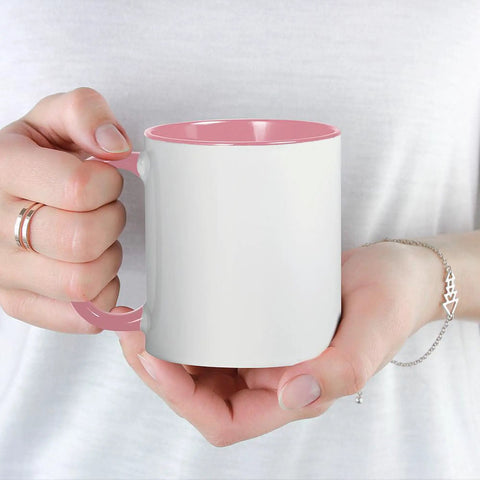 Premium Quality Ceramic Coffee Mug With Dope Golf Cart Graphics Made To Keep Up With Your Daily Grind Ideal For Iced Lattes Or Strong Black Coffee During Your Office Routine held in hand with pink interior.