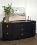 Sideboard painted with Matte Black Caviar Chalk Finish Furniture Paint 32oz for DIY Makeovers with décor items displayed on top.