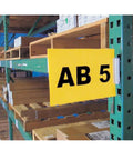 Yellow Warehouse Aisle Pallet Rack Sign Kit For Clear Inventory Signs Includes 10 Label Holders And 12 Laser Sheets Five And One Half By Eight And One Half Inches No Brainer Easy Snap In Aisle Sign System For Streamlined Warehouse Organization. Yellow aisle sign clipped to green pallet rack, AB 5