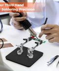 Helping Hands Soldering Station With Rock Solid Base Dual Magnetic Arms Adjustable Clamp Stand in use for electronics.