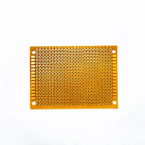 Top view of a 5x7 cm single-sided Bakelite circuit board from the 20 Piece 5 By 7 Cm Yellow Universal Breadboard Prototyping Boards set.