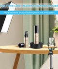 Bosgladek Motorized Rotating Display Stand showcasing beauty products on a wooden table with mobile phone setup for live displays.