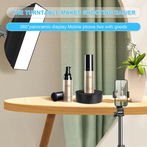 Bosgladek Motorized Rotating Display Stand showcasing beauty products on a wooden table with mobile phone setup for live displays.