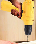 Heavy Duty Cordless Electric Drill Kit With Ergonomic Soft Touch Grip And Rapid Bit Exchange in use drilling wood.