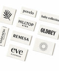 Next Level Custom Cotton Tags Straight Up Premium Fabric Sewing Labels For Quilting Knitting Handmade Clothing Branding Markers Machine Washable Care Instructions 40X50Mm with various brand logos.