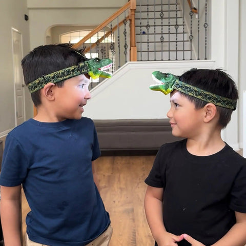 Two children wearing Roaring T Rex Dinosaur Headlamp For Kids And Adults LED Headlight Toy Flashlight With Super Bright Light.