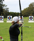 Archer aiming at 20 Inch Archery Target Set Lightweight High Density EVA Block With 10 Target Papers And 4 Small Nails Outdoors
