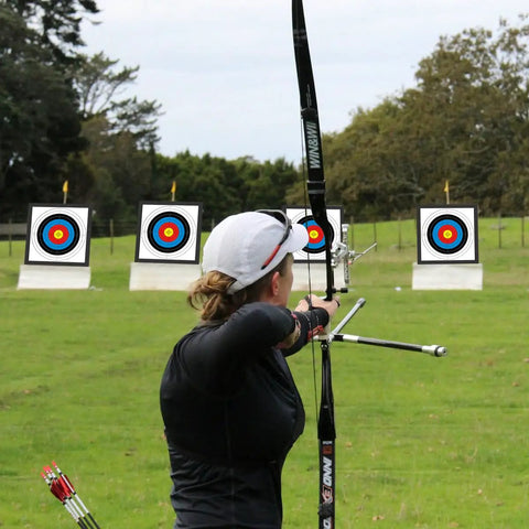 Archer aiming at 20 Inch Archery Target Set Lightweight High Density EVA Block With 10 Target Papers And 4 Small Nails Outdoors
