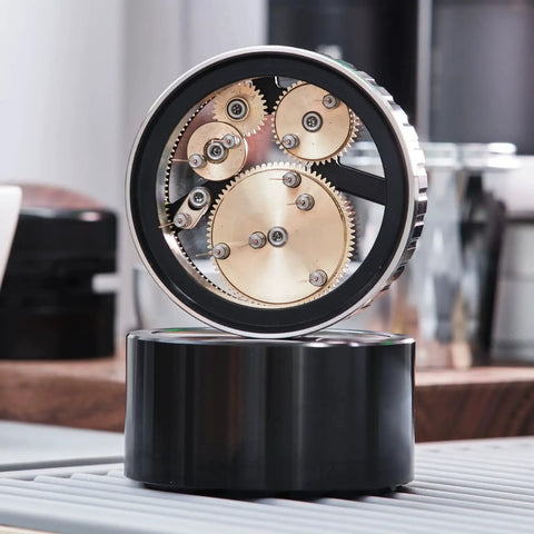 Slick 58mm Coffee Distributor Needle With Geared Spinning Action And Sturdy Black Base, Smooth Espresso Leveler displayed at an angle.