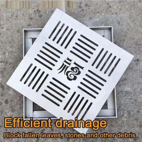Smooth Operator 304 Stainless Steel Square Shower Drain Cover And Yard Catch Basin Grate sitting over a drainage trench.
