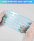 Hands wearing gloves holding a sturdy blue tray component of a Heavy Duty 50 Hole Test Tube Rack for 13, 16, and 18mm tubes.