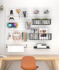 Pegboard Organizer Kit With Bins, Transparent Cups, Wire Baskets, Paper Towel Holder And Hooks, 42 Piece Pegboard Accessories Set For Garage, Workshop And Craft Room Storage, installed on wall above desk.