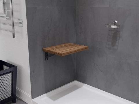 Wall Mount Foldable Teak Shower Bench 17 By 12.6 Inch Teakwood Bath Seat in bathroom, mounted on gray wall, folded out.