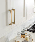 Merced 6-5/16 Inch Center To Center Champagne Bronze Cabinet Pull for cabinets installed on white kitchen cabinets