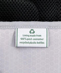 Close-up label showing eco-friendly lining on Softside Underseat Carry On Bag With Wheels Lightweight 15-Inch Luggage For Travel Compact Upright