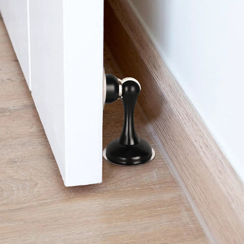 Heavy Duty Magnetic Door Stop Set, 2 Pack, Stainless Steel Black Finish, No Drill Adhesive Door Stops For Wall Or Floor Mount, Strong Tape, Keeps Doors Open, Protects Walls From Slams installed on wall behind door