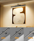 Wireless Rechargeable Picture Light Black 24 Inch Wall Sconce With Remote And Timer at different brightness levels above art.