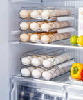 Three Layer Ramp Type Auto Rolling Egg Holder For Fridge, clear stackable egg storage container, holds up to 18 eggs per layer