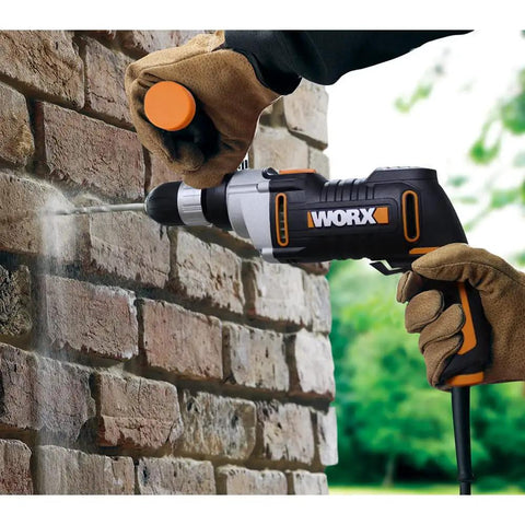 User drilling into brick wall with Knockout Impact Drill Packing 810 Watts And A Beefy 13 Mm Chuck Featuring Variable Speed Control.