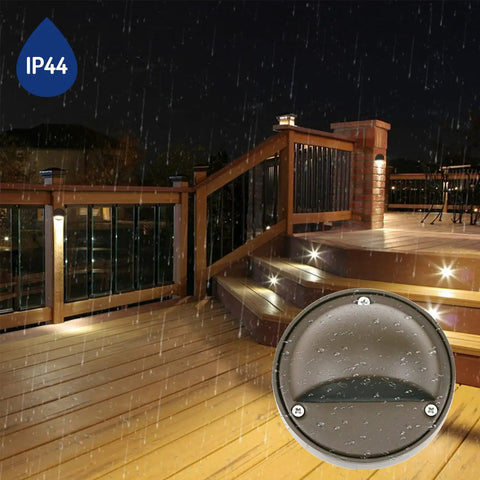 Low Voltage 2W G4 LED Deck Lights With Replaceable Bulb 3000K 180 Lumen bronze aluminum lights on rain-soaked stairs