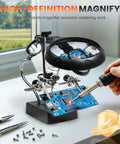 Desktop LED Magnifying Glass Soldering Station With Handy Helping Hands, 2.5X 7.5X 10X Magnifier on desk with blue circuit board