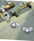 Set Of Four Heavy Duty Adjustable Sliding Door Rollers With Precision Bearings Buttery Smooth Glide Easy Side Or Vertical Mounting On Closets Barn Doors, featuring close-up of rollers on wooden surface.