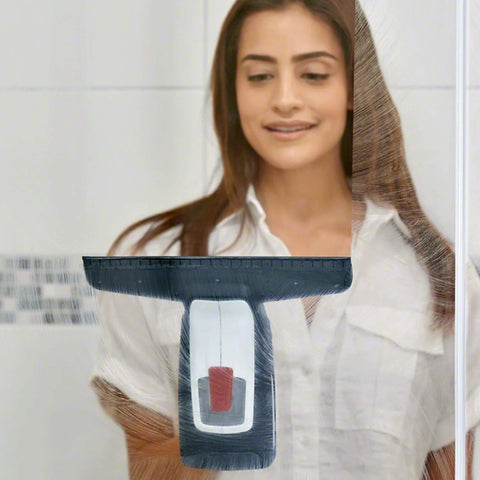 Front view of a black Bosch GlassVAC window vacuum cleaner with gray handle, held by a woman.