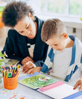 Child using Pink 3 Hole Binder Punch, Compact Desk Tool With 5 Sheet Capacity, Includes 10 Inch Ruler, paper and coloring tools