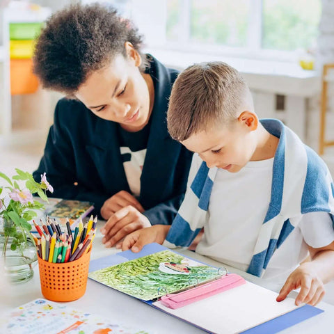 Child using Pink 3 Hole Binder Punch, Compact Desk Tool With 5 Sheet Capacity, Includes 10 Inch Ruler, paper and coloring tools
