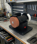 Heavy Duty Bench Grinder With Debris Guard And Anti Slip Base For 18V Lithium Batteries stable operation on workshop bench.