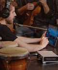 Musician using 10 In 2 Out USB Audio Interface With MIDI And DAW Software For Songwriting, Podcasting, And Home Studio Recording