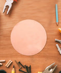 Copper Round Plate 0.5mm Thick, 150mm Diameter Solid Copper Sheet For DIY Repairs, Handyman Projects, Industrial Use, And Craft Supplies, Great For Metalwork, Home Improvements, And Artsy Crafts on a wood table