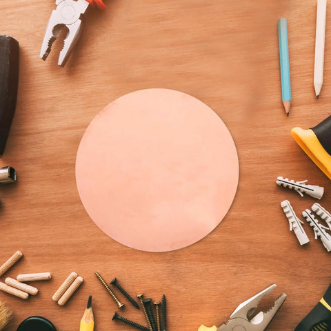 Copper Round Plate 0.5mm Thick, 150mm Diameter Solid Copper Sheet For DIY Repairs, Handyman Projects, Industrial Use, And Craft Supplies, Great For Metalwork, Home Improvements, And Artsy Crafts on a wood table