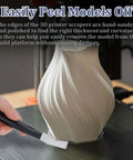 Person using Stainless Steel 3D Printer Scraper Tool With Large Head For Resin Removal And Model Stripping on 3D print.