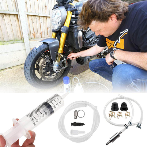 Person using All In One Brake Bleed Kit For Hydraulic Disc Clutches And Car Brakes With 100ml Syringe, Hoses, Adapters on motorcycle