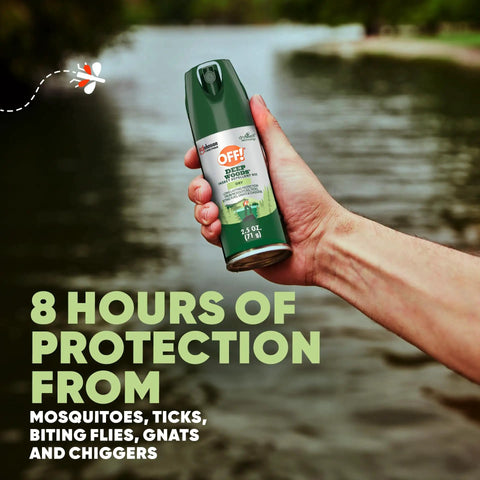 Person holding Deep Woods Travel Size Insect Repellent Aerosol With Dry Non Greasy Formula Bug Spray For Twenty Five Percent DEET All Day Protection Against Mosquitoes Ticks Flies Gnats And Chiggers Two And A Half Ounce Can by a lake.