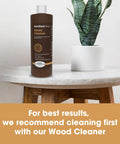Heavy Hitter Danish Oil Wood Sealer Slips Right On And Leaves A Bully Satin Shield on a marble table with a plant.