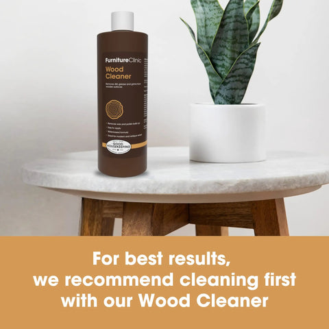 Heavy Hitter Danish Oil Wood Sealer Slips Right On And Leaves A Bully Satin Shield on a marble table with a plant.
