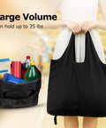 Person holding Ultra Lightweight Foldable Grocery Tote Bags Set Waterproof Reusable Shopping Bags For Groceries Nylon Tote Bags Pocket Fold Grab And Go 1 Pack 2 Pack Or 4 Pack Black, showing large capacity, filled with groceries.