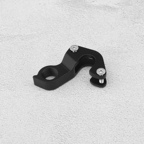 KP158 Aluminum Bike Rear Derailleur Hanger And Double Layer Tail Hook For Road Bikes on a light surface