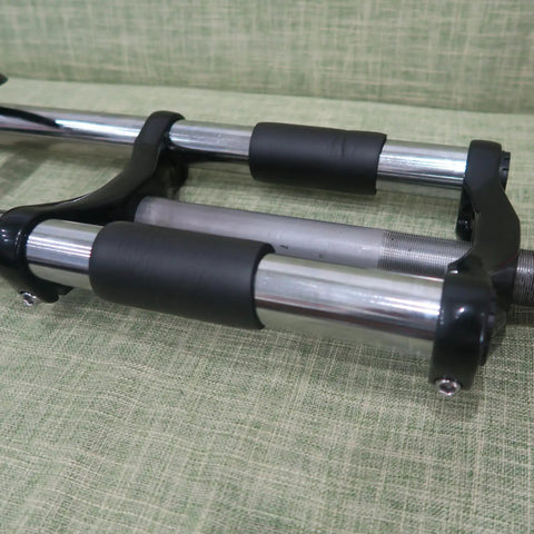 Close-up of Beefed Up 26 Inch Suspension Fork With 1 Inch Threaded Steerer 25.4mm Straight Tube in black, detail view.