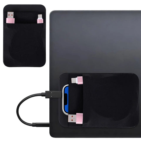 Stick On Dual Pocket SSD Carrying Case With Reusable Adhesive for laptops, attached to laptop, holding cables and USB drive.