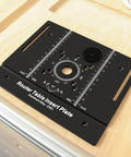 Built Tough Anodized Aluminum Router Insert Plate With Dead On Miter Grooves for electric routers on workbench.