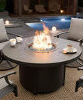 48 Inch Round Propane Fire Pit Tabletop Outdoor Heater With Auto Ignition 55000 BTU CSA Certified in patio setting with chairs