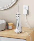 Magnetic Replacement Charger Cord For Water Flosser, Compatible With WP 560 562 563 567 569, charging a flosser on a countertop
