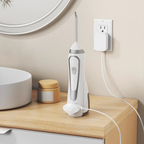 Magnetic Replacement Charger Cord For Water Flosser, Compatible With WP 560 562 563 567 569, charging a flosser on a countertop