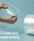 Hands holding 12 Inch Wide By 800 Feet Clear Polyethylene Tubing Roll 2.1 Mil Thick Heavy Duty Plastic Wrap for Shipping.